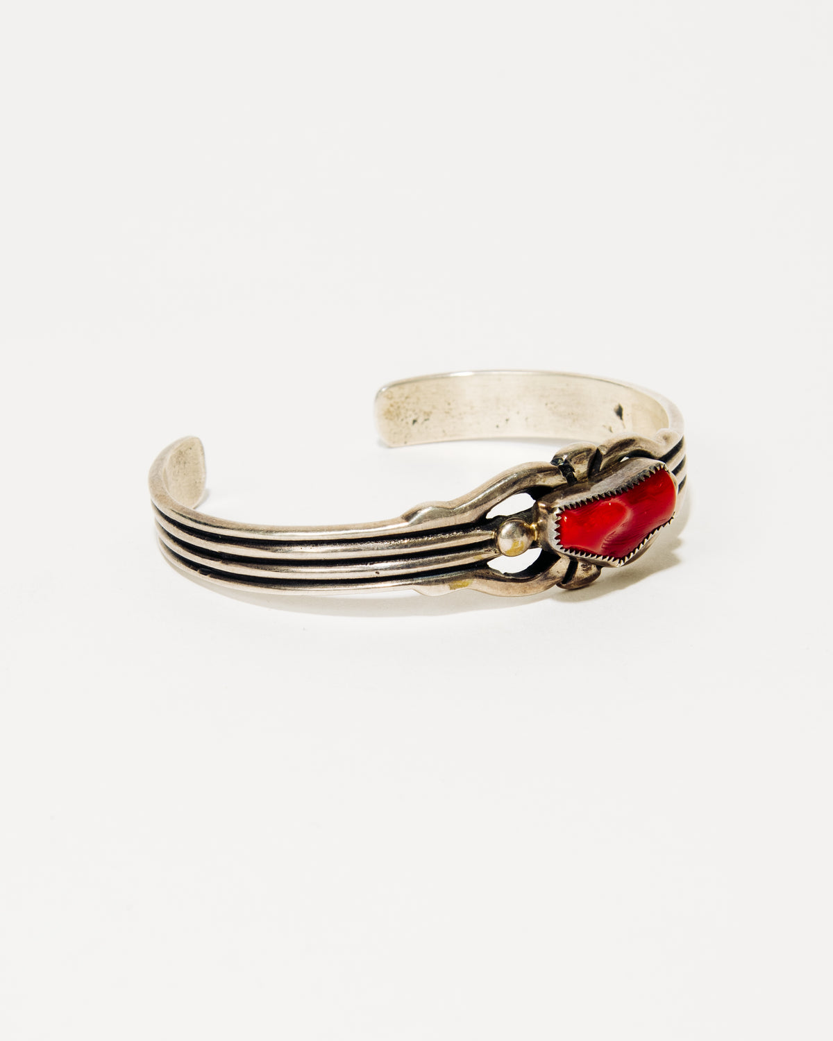 Carolyn and Wilson Begay Navajo Silver Bracelet with Coral Cabochon