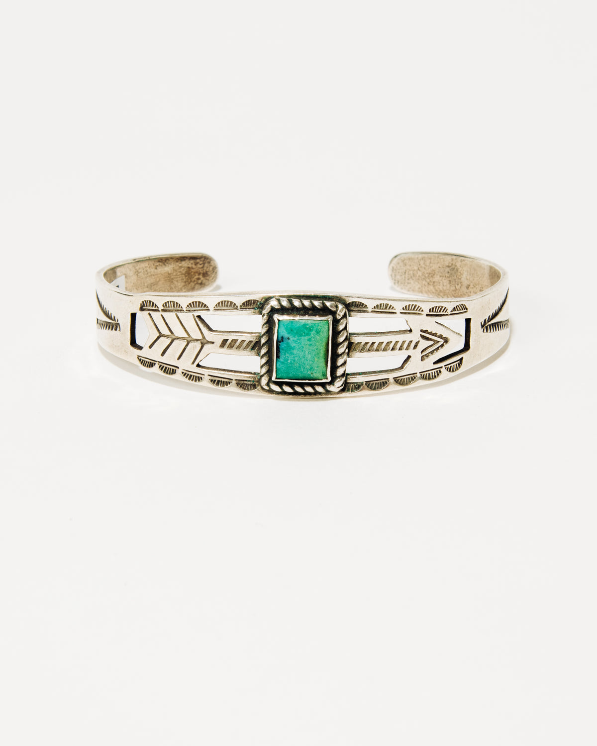 Navajo Stamped Silver Bracelet with Arrow and Turquoise Cabochon, c. 1940